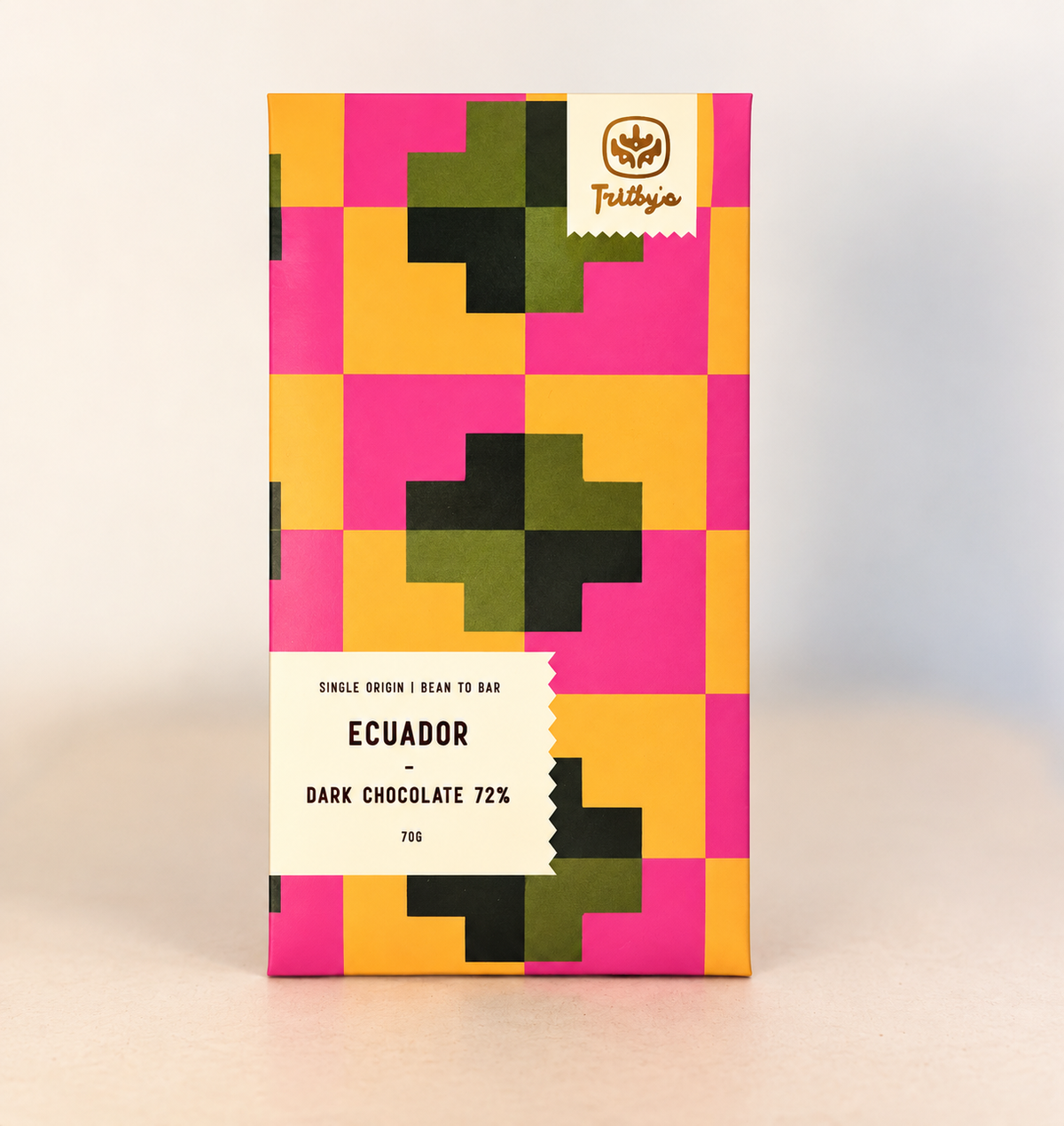 Single Origin Ecuador 72% dark chocolate bar in a pink, yellow and green patterned wrapper
