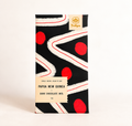 Single Origin PNG 86% dark chocolate bar in a black wrapper with white lines and red dots
