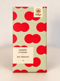 Raspberry & Pistachio milk chocolate bar in a pale green wrapper with red circles