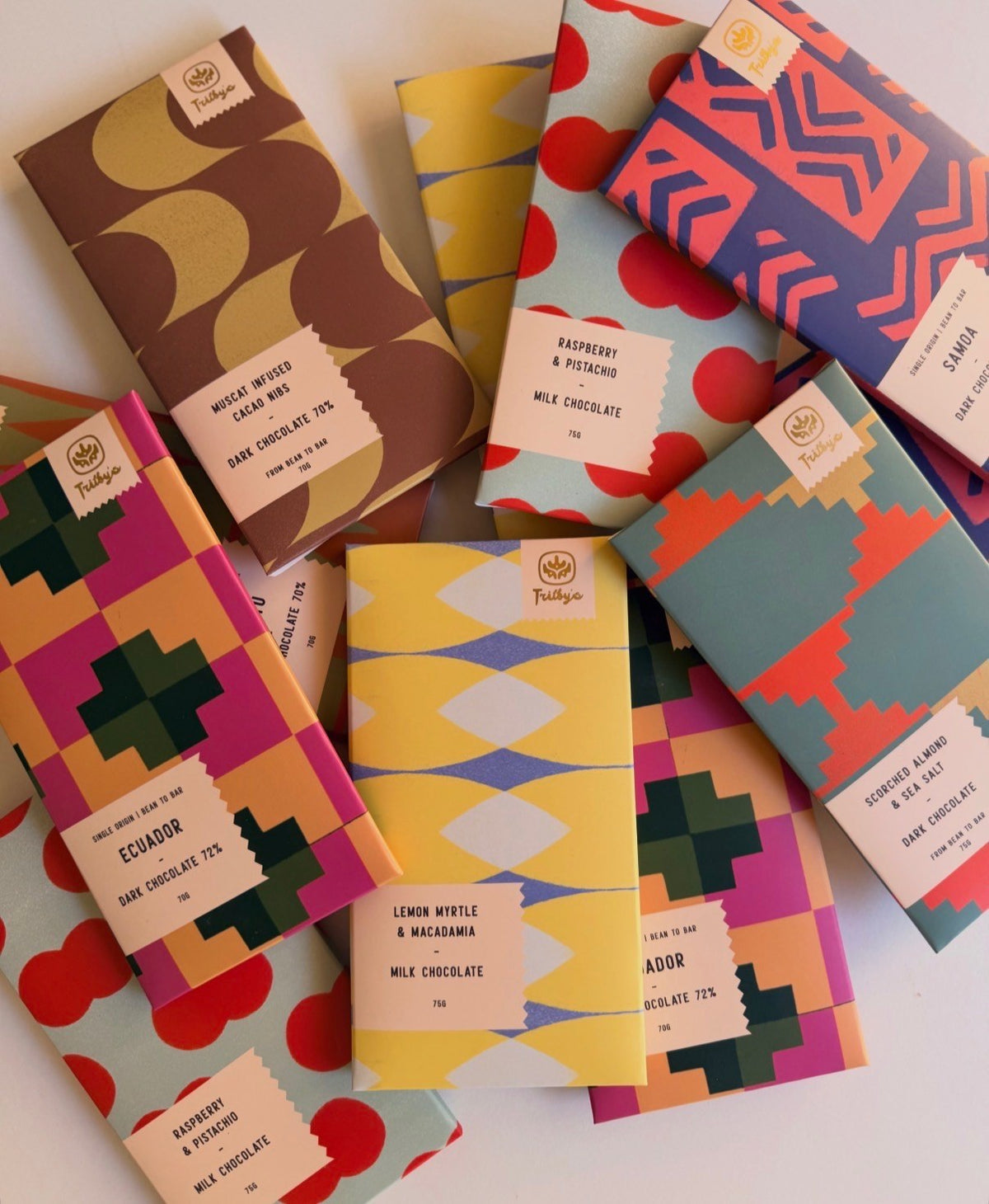 First Crack chocolate subscription, a selection of Trilby's chocolate bars in colourful patterned wrappers